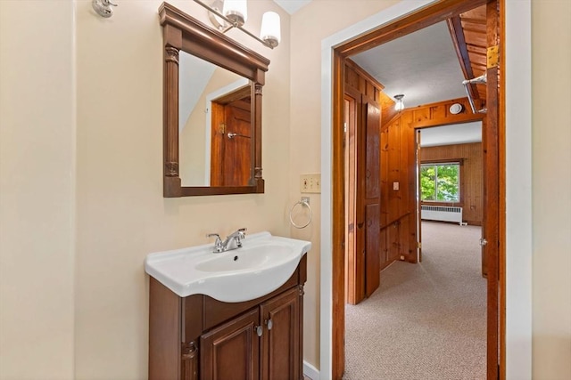 49 Bay View Dr, Shrewsbury, MA 01545 - bathroom featuring radiator heating unit, vanity, and wood walls