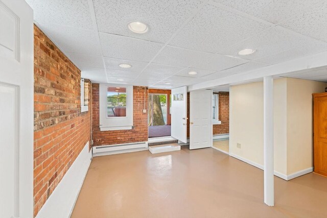 49 Bay View Dr, Shrewsbury, MA 01545 - interior space featuring brick wall, a baseboard heating unit, a paneled ceiling, baseboards, and recessed lighting