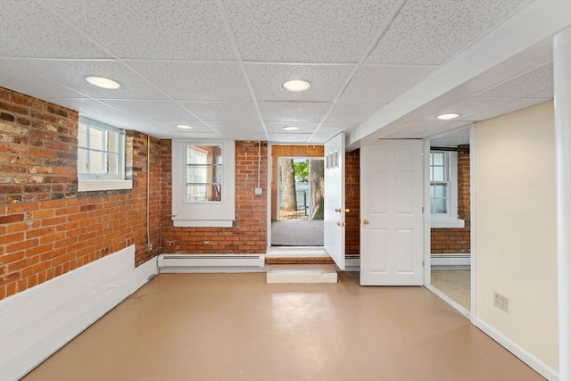 49 Bay View Dr, Shrewsbury, MA 01545 - foyer entrance with brick wall, a paneled ceiling, a baseboard heating unit, concrete flooring, and recessed lighting