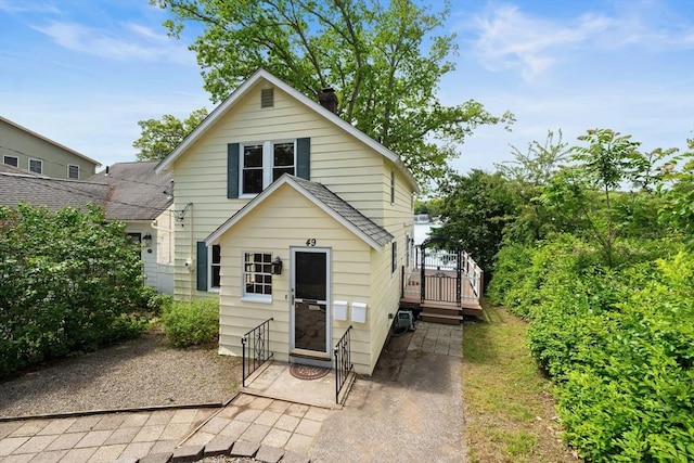 49 Bay View Dr, Shrewsbury, MA 01545 - view of front of home with a wooden deck and a chimney