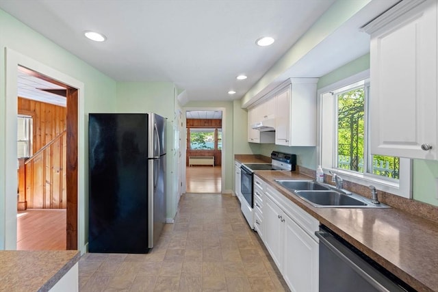 49 Bay View Dr, Shrewsbury, MA 01545 - kitchen with appliances with stainless steel finishes, a sink, white cabinetry, under cabinet range hood, and recessed lighting