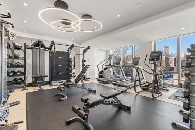 gym featuring floor to ceiling windows