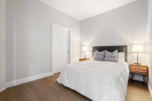 bedroom with hardwood / wood-style flooring