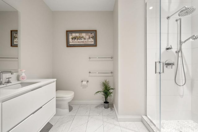 bathroom with vanity, toilet, and walk in shower