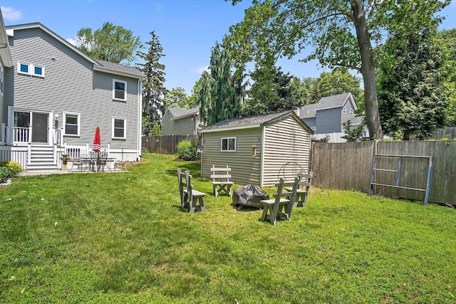 11 Broadway St Unit 2, Stoneham, MA 02180 - fenced backyard featuring a storage shed and a patio area