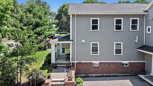 11 Broadway St Unit 2, Stoneham, MA 02180 - back of house with a shingled roof