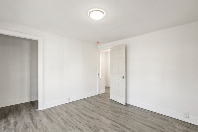 empty room featuring wood-type flooring