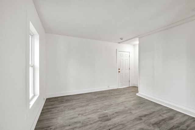 empty room featuring dark hardwood / wood-style flooring