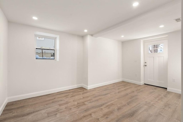 basement featuring light hardwood / wood-style flooring