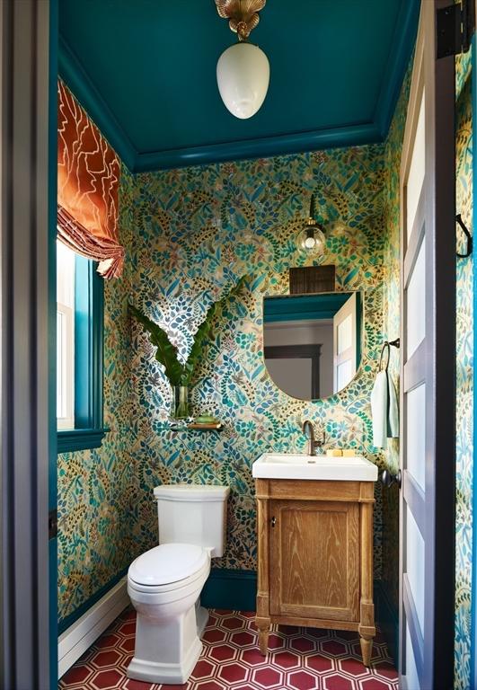 bathroom featuring ornamental molding, baseboards, toilet, baseboard heating, and wallpapered walls