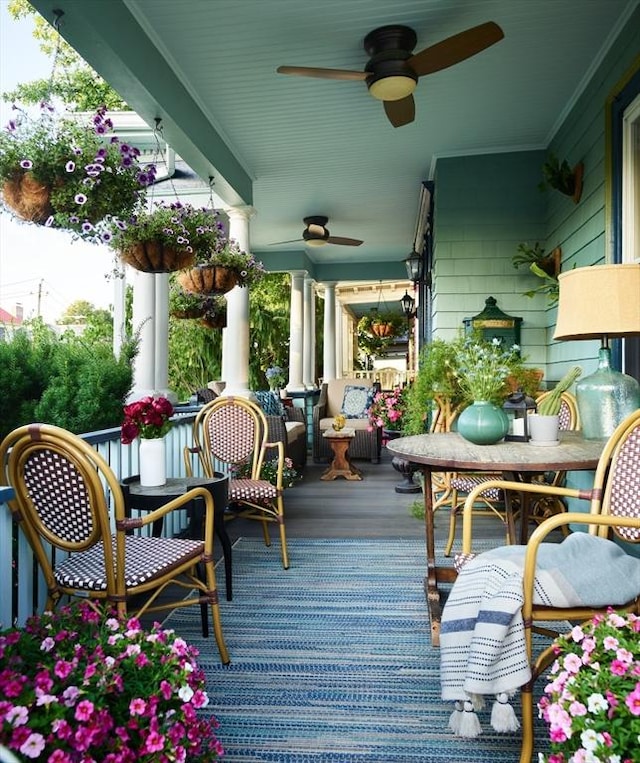 wooden deck featuring ceiling fan and a porch