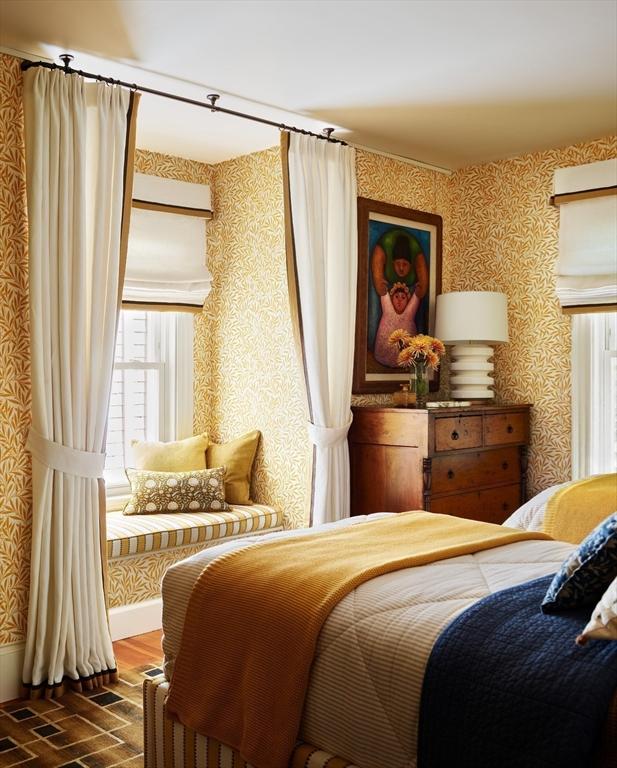 bedroom featuring wallpapered walls and dark wood-type flooring