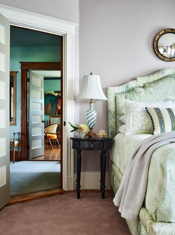 carpeted bedroom with baseboards