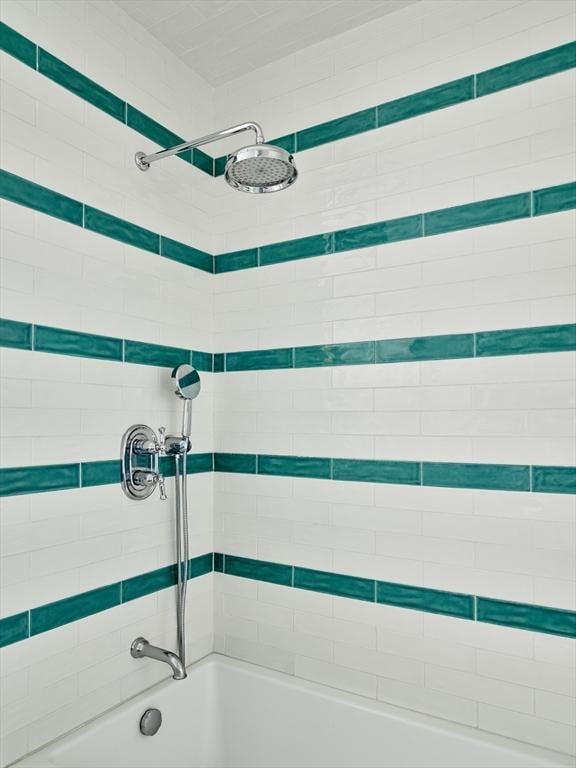 full bath featuring tub / shower combination