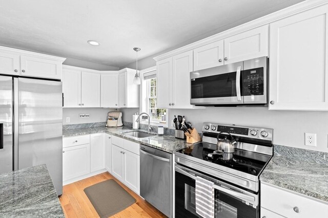 111 Spruce St, Middleboro, MA 02346 - kitchen with appliances with stainless steel finishes, a sink, white cabinetry, and recessed lighting