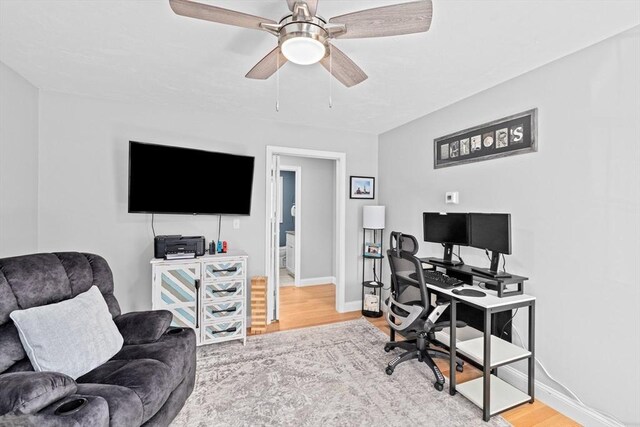 111 Spruce St, Middleboro, MA 02346 - office area with wood finished floors, baseboards, and ceiling fan