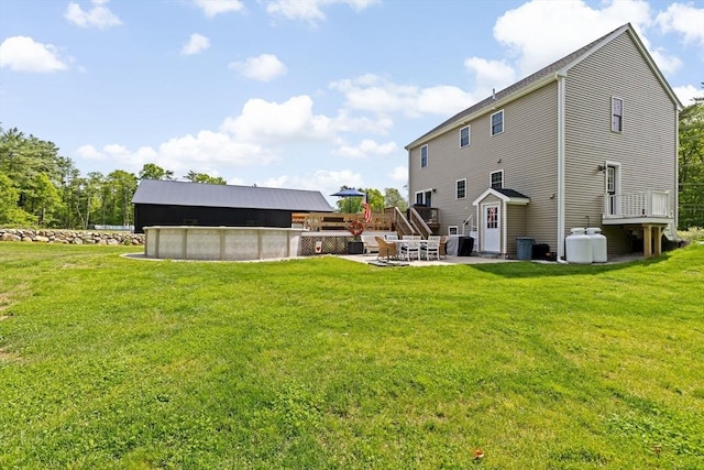 111 Spruce St, Middleboro, MA 02346 - back of house with a covered pool, a yard, a patio, and a deck