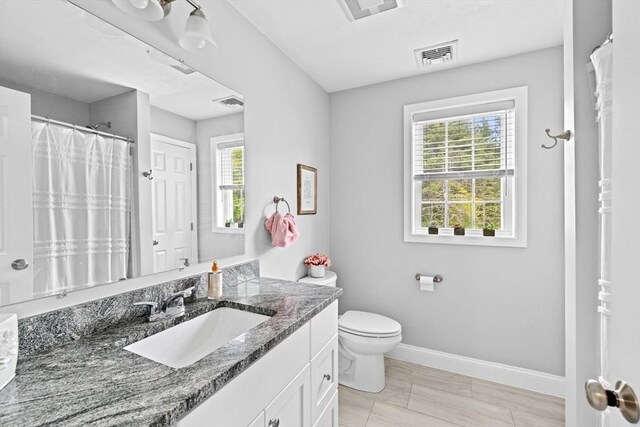 111 Spruce St, Middleboro, MA 02346 - full bath featuring vanity, toilet, baseboards, and curtained shower