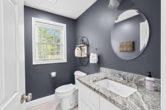 111 Spruce St, Middleboro, MA 02346 - bathroom featuring vanity, toilet, and baseboards