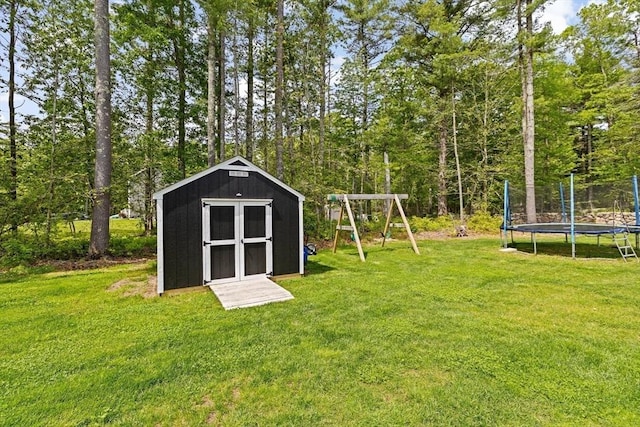 111 Spruce St, Middleboro, MA 02346 - view of green lawn featuring a trampoline and a playground