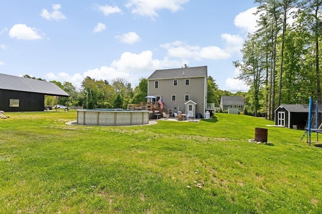 111 Spruce St, Middleboro, MA 02346 - back of house featuring a yard, an outdoor pool, and a deck