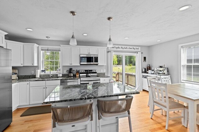 111 Spruce St, Middleboro, MA 02346 - kitchen featuring a sink, stainless steel appliances, healthy amount of natural light, recessed lighting, and white cabinets