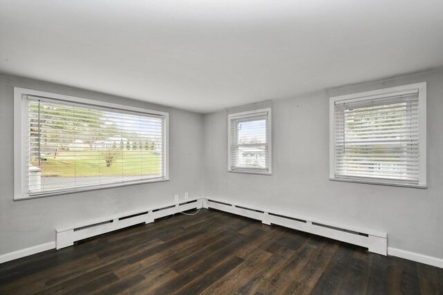 41 Bryant St, Pittsfield, MA 01201 - spare room featuring wood finished floors, a baseboard heating unit, and baseboards