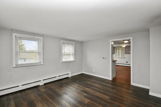 41 Bryant St, Pittsfield, MA 01201 - unfurnished room featuring a baseboard heating unit, baseboard heating, wood finished floors, and baseboards