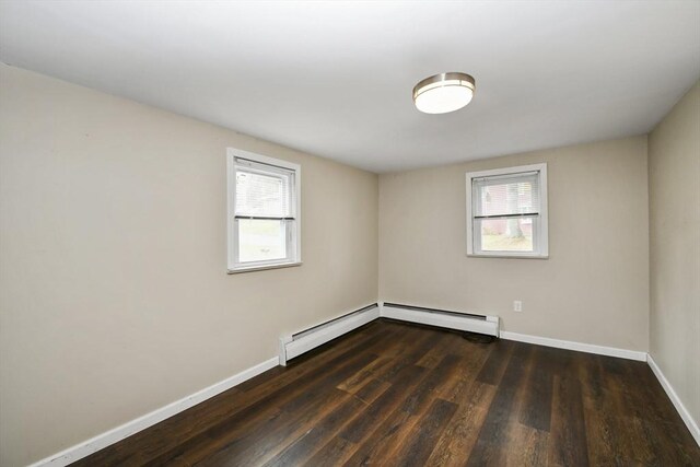 41 Bryant St, Pittsfield, MA 01201 - empty room with baseboards, baseboard heating, wood finished floors, and a healthy amount of sunlight