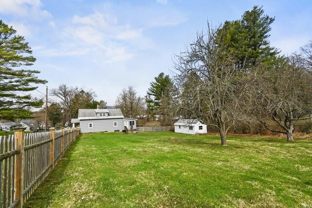 41 Bryant St, Pittsfield, MA 01201 - view of yard with an outdoor structure, a storage unit, and fence private yard