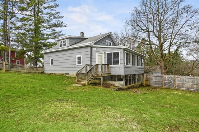 41 Bryant St, Pittsfield, MA 01201 - back of house with a sunroom, a yard, a fenced backyard, and a chimney