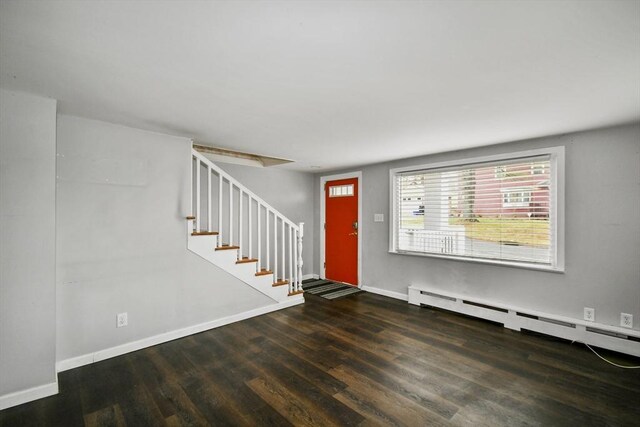 41 Bryant St, Pittsfield, MA 01201 - foyer entrance featuring baseboards, wood finished floors, stairs, and a baseboard radiator