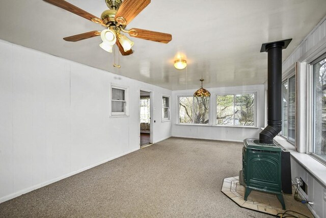 41 Bryant St, Pittsfield, MA 01201 - unfurnished sunroom with a wood stove and a wealth of natural light