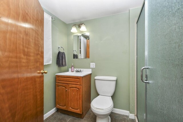 41 Bryant St, Pittsfield, MA 01201 - bathroom featuring toilet, vanity, a shower stall, and baseboards