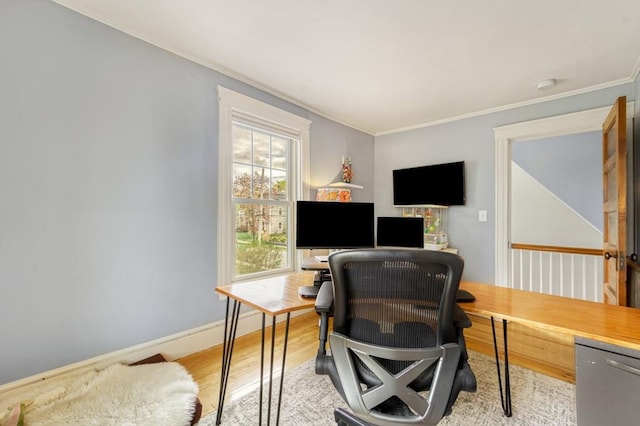 home office with baseboards, ornamental molding, and light wood finished floors