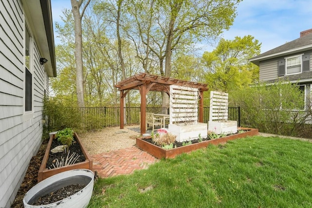 view of yard featuring a fenced backyard, a pergola, and a vegetable garden