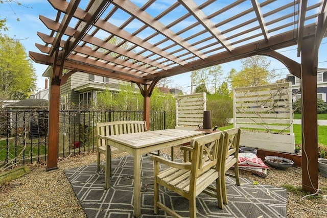 view of patio / terrace with a pergola, fence, and outdoor dining area