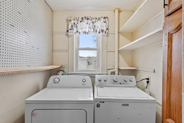 laundry room featuring laundry area and washing machine and clothes dryer