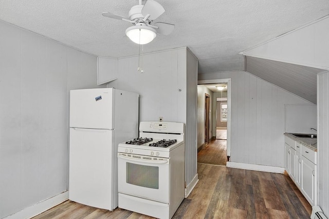 kitchen featuring a baseboard radiator, white appliances, dark wood-type flooring, white cabinetry, and light countertops