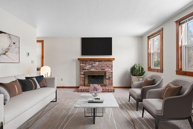 living room with carpet and a brick fireplace