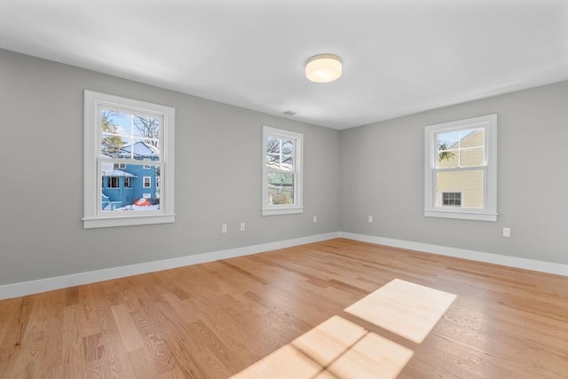 spare room featuring light hardwood / wood-style floors