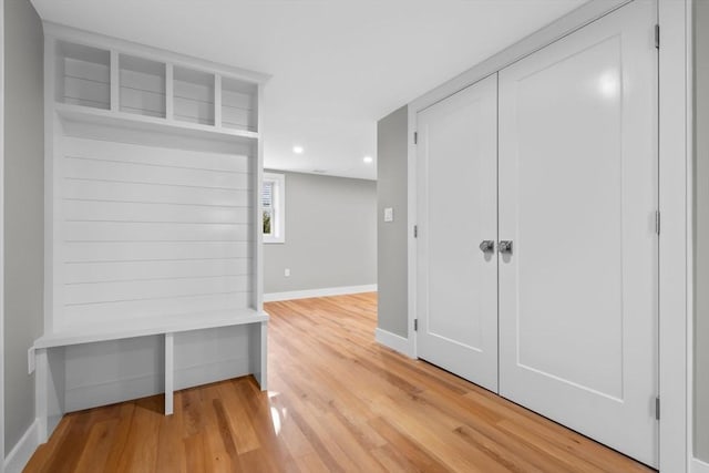 mudroom with hardwood / wood-style floors