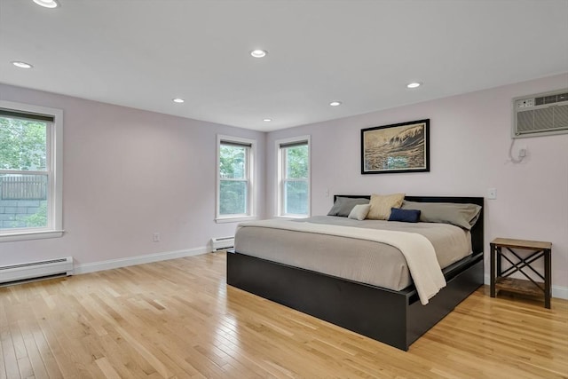 10-12 Spring Rd, Arlington, MA 02476 - bedroom with a baseboard heating unit, multiple windows, a wall mounted air conditioner, light wood-style floors, and recessed lighting