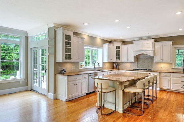 19 Mulberry Ln, Franklin, MA 02038 - kitchen with dishwasher, light stone counters, gas stovetop, a kitchen breakfast bar, and a sink