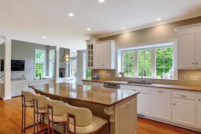 19 Mulberry Ln, Franklin, MA 02038 - kitchen featuring a sink, a center island, plenty of natural light, white cabinets, and recessed lighting