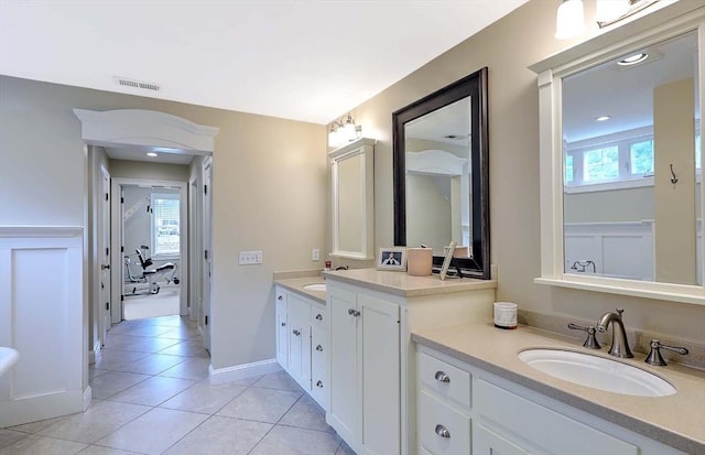 19 Mulberry Ln, Franklin, MA 02038 - full bathroom with two vanities, tile patterned floors, and baseboards