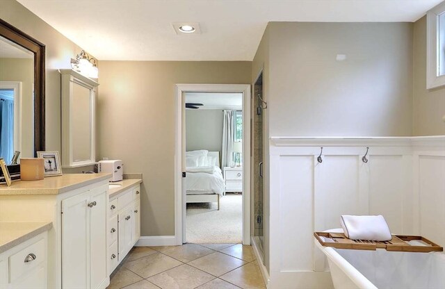 19 Mulberry Ln, Franklin, MA 02038 - ensuite bathroom with vanity, a soaking tub, tile patterned floors, and a shower stall