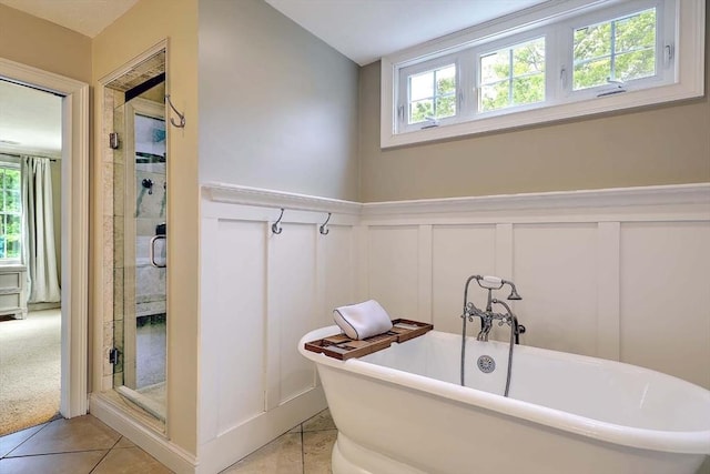 19 Mulberry Ln, Franklin, MA 02038 - bathroom with a decorative wall, healthy amount of natural light, a soaking tub, a shower stall, and tile patterned flooring
