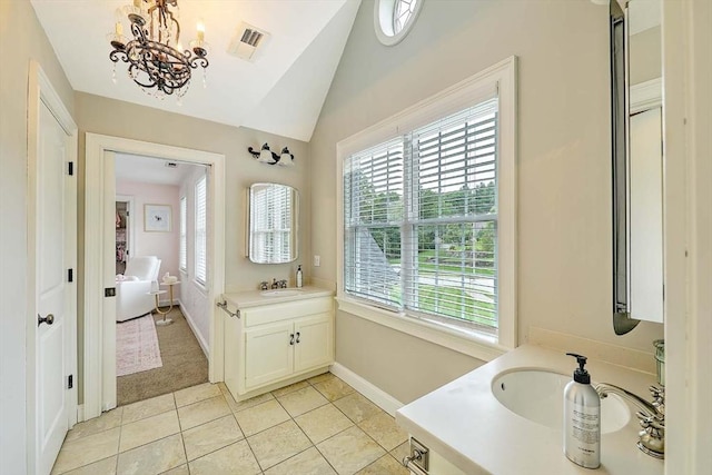 19 Mulberry Ln, Franklin, MA 02038 - bathroom featuring vanity, vaulted ceiling, tile patterned floors, a chandelier, and baseboards