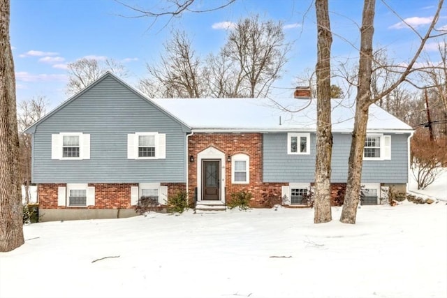 bi-level home with brick siding